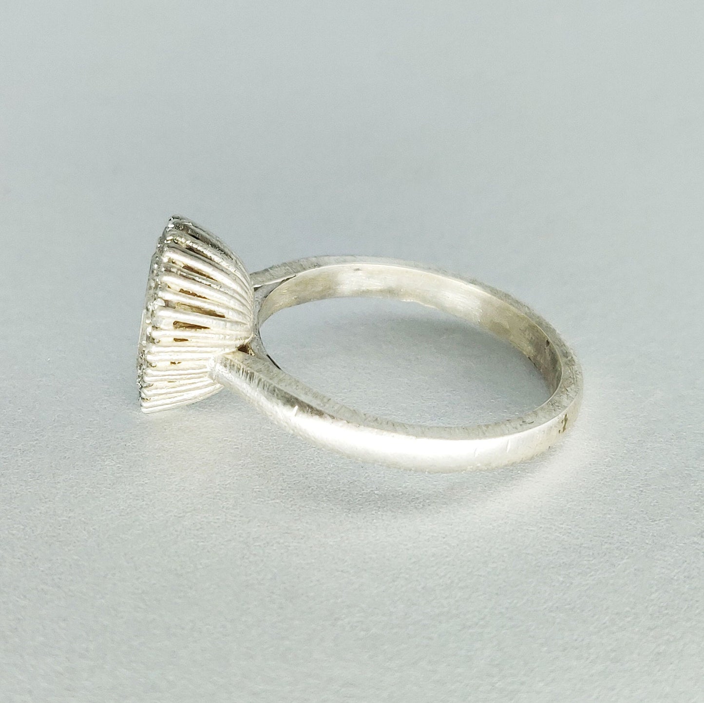 Elegant Trillion Cut Silver Halo Ring with Pave Cubic Zirconia Cluster