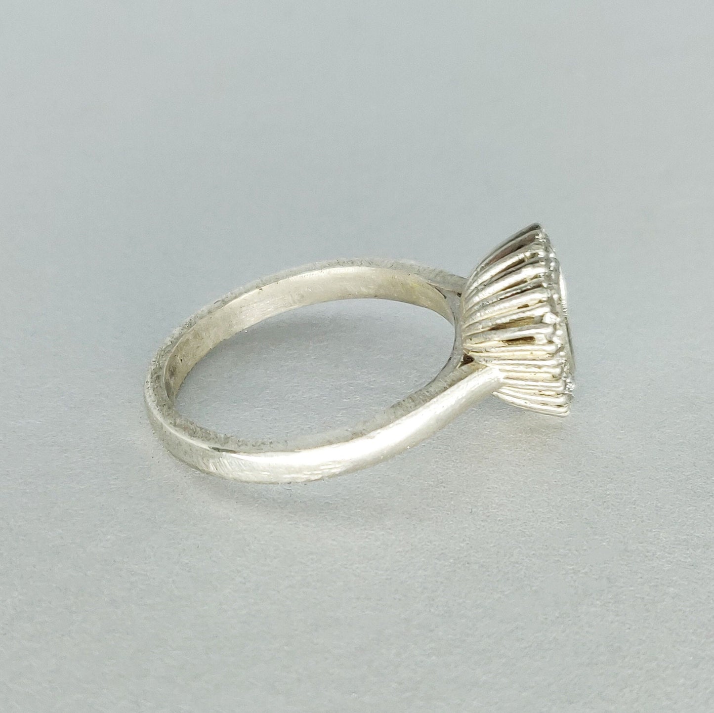 Elegant Trillion Cut Silver Halo Ring with Pave Cubic Zirconia Cluster