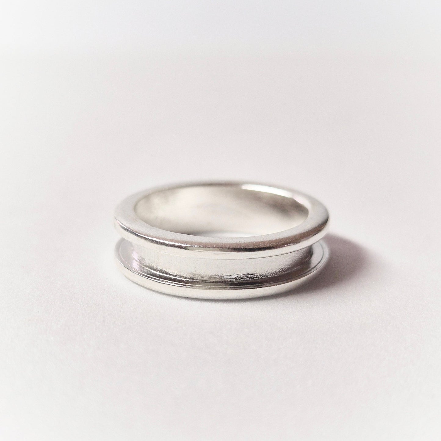 Silver Channel Ring Flat on White Background.