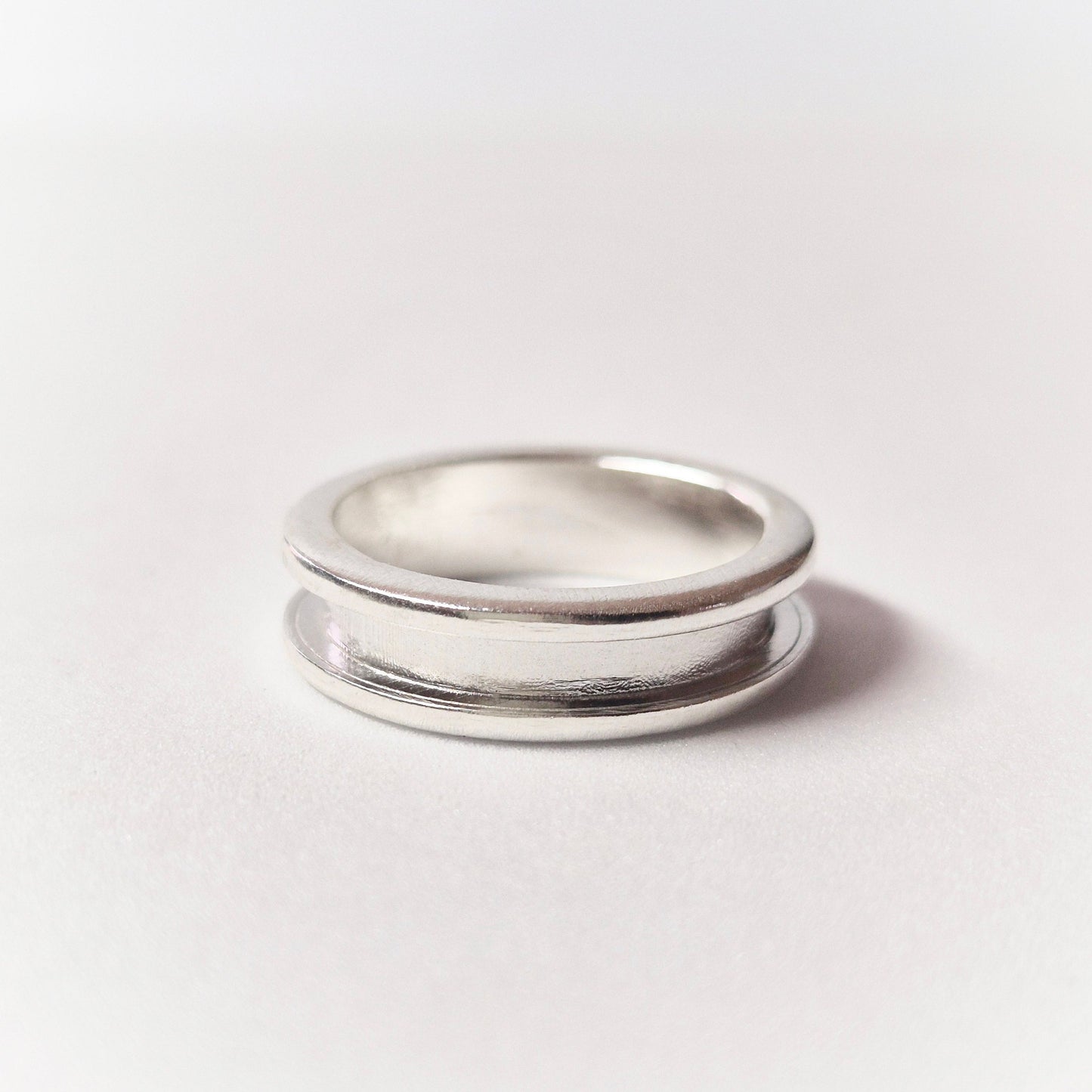 Silver Channel Ring Flat on White Background.