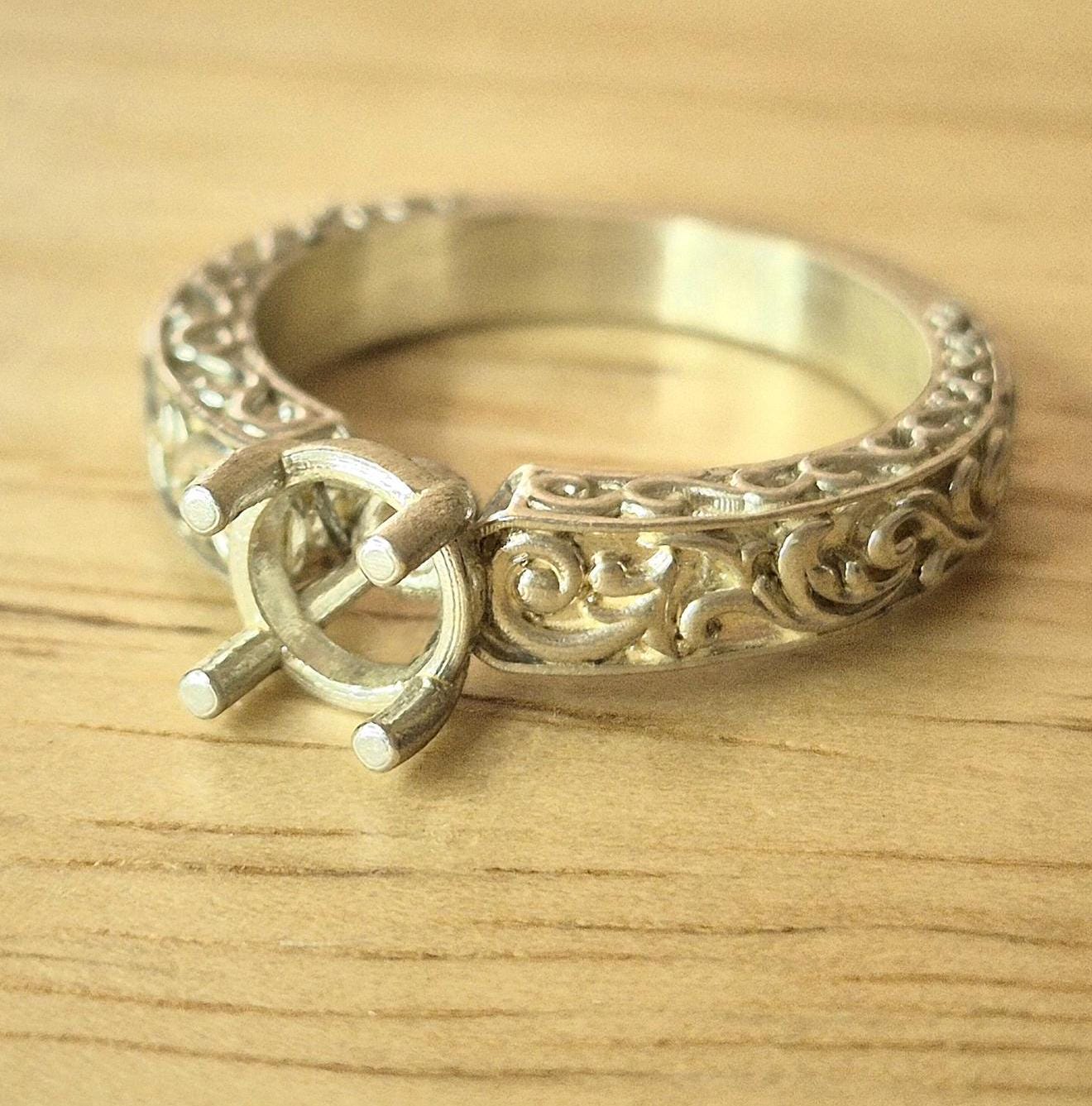 Front view of a silver victorian style scroll ring
