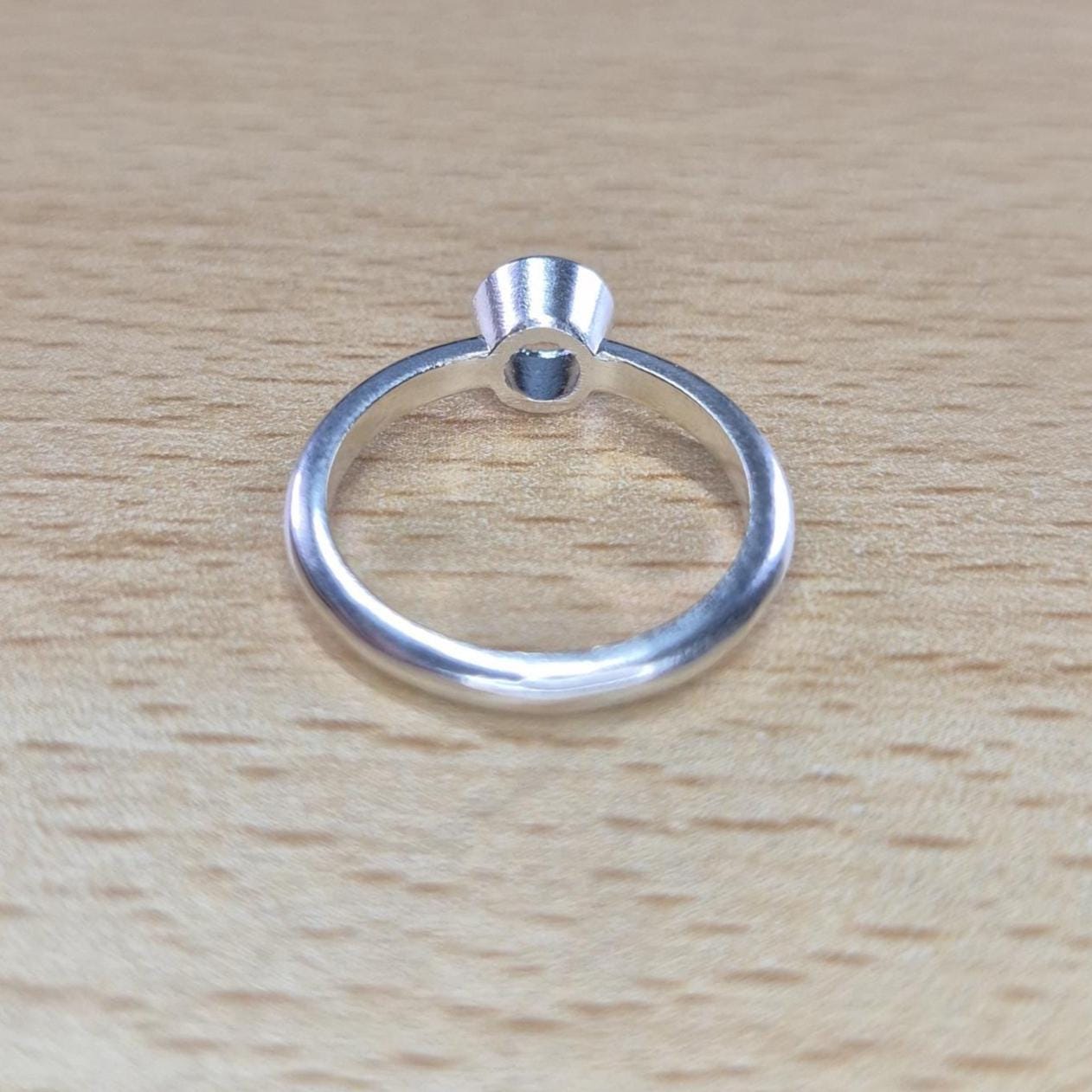 Bottom View of a Silver Bezel Ring