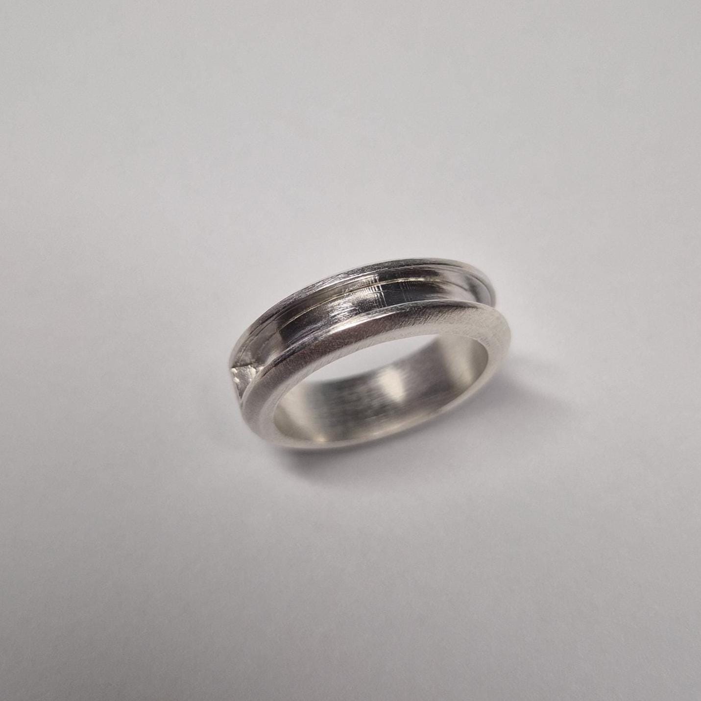 Minimalist half channel ring on a white background, designed for channel setting or decorative inlay.