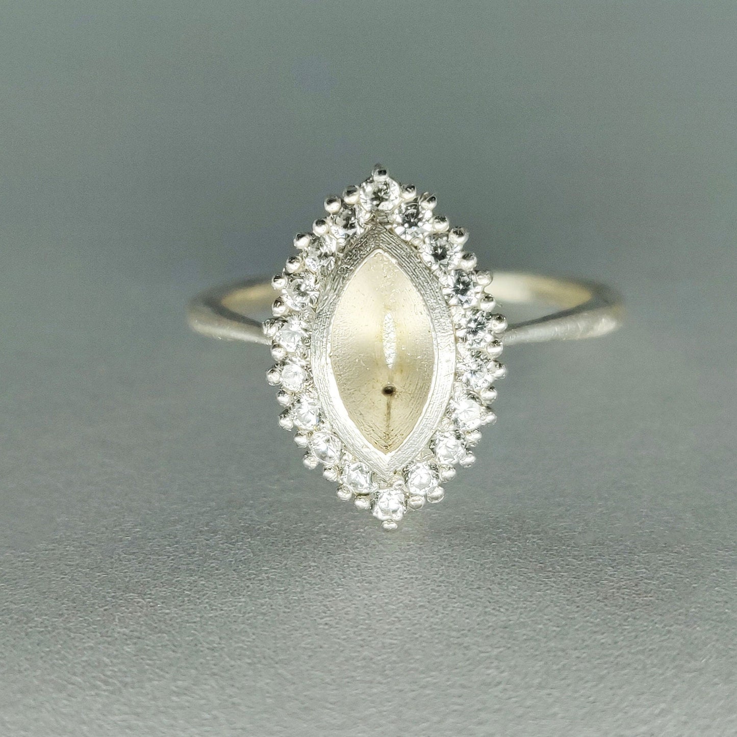 Front View of Bezel Set Cluster Marquise Semi Mount Cluster Multistone Silver Ring on a White Background.