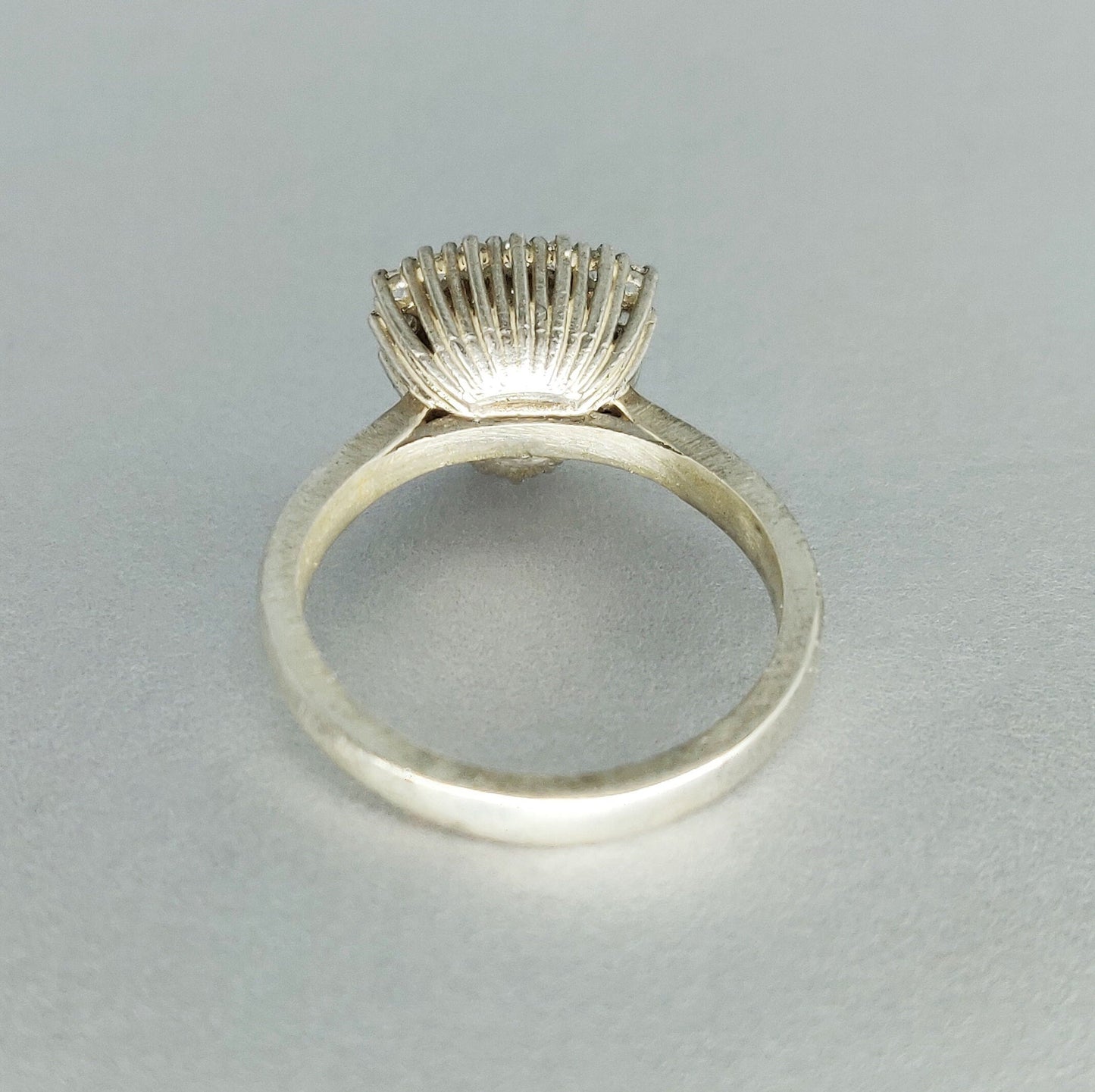 Elegant Trillion Cut Silver Halo Ring with Pave Cubic Zirconia Cluster