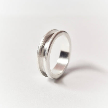 Silver Channel Ring on a White Background