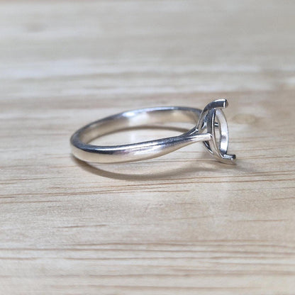 Angled view of an unset silver ring with open 2-prong marquise setting, perfect for DIY jewelers and stone setters.