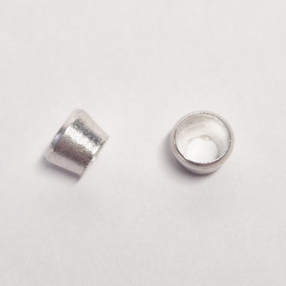 Two 4mm sterling silver bezel cups shown at different angles to display depth and finish, ideal for gemstone mounting.