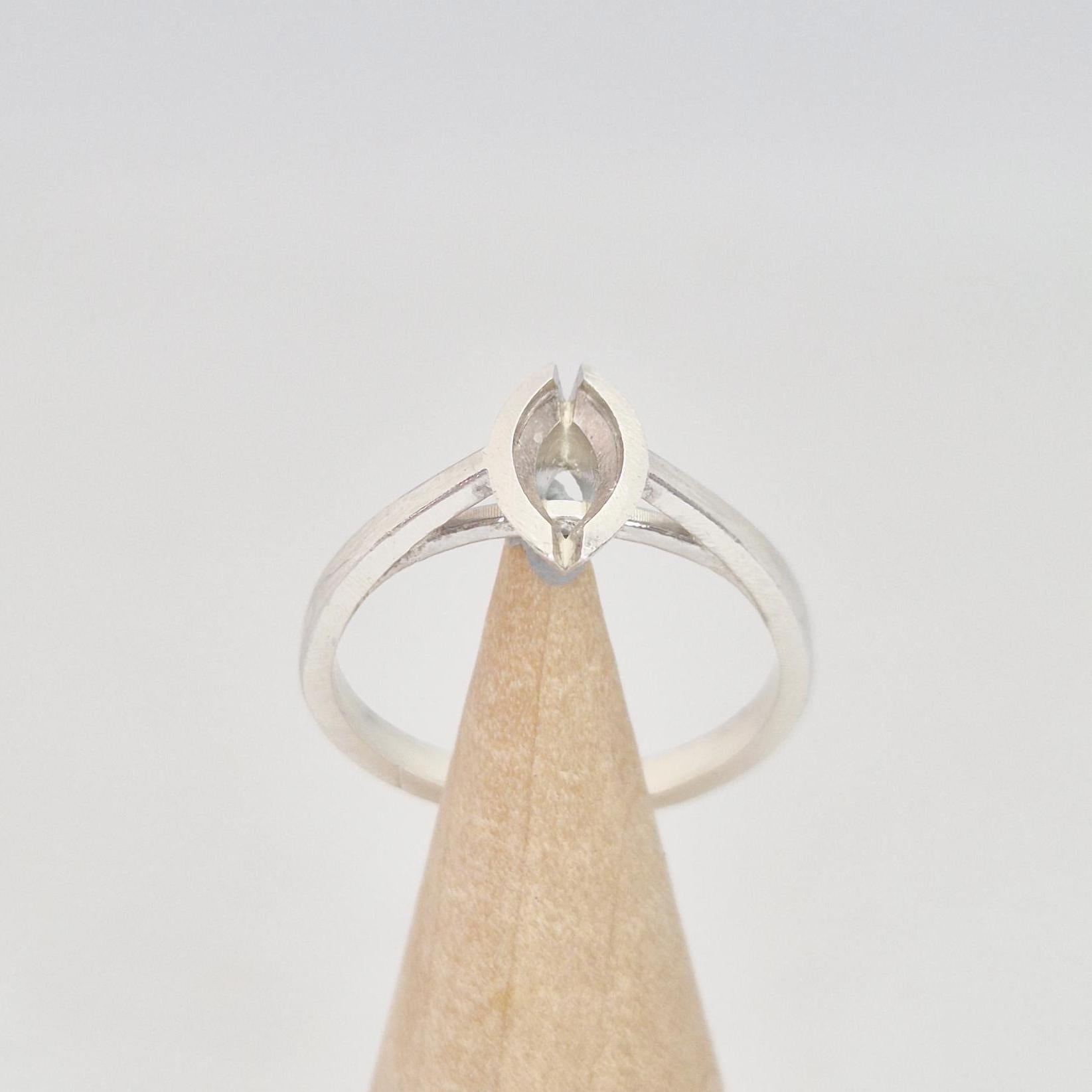 Silver marquise split bezel ring blank on a conical wooden ring holder, viewed from the front, showing the empty marquise-shaped split bezel setting.