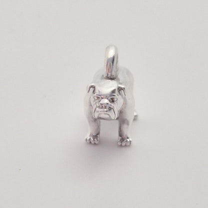 Front-facing view of a silver bulldog charm with top loop, showing the symmetrical stance and detailed paws.