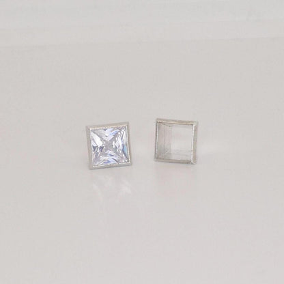7mm square bezel setting in sterling silver with princess cut stone and empty setting frame.