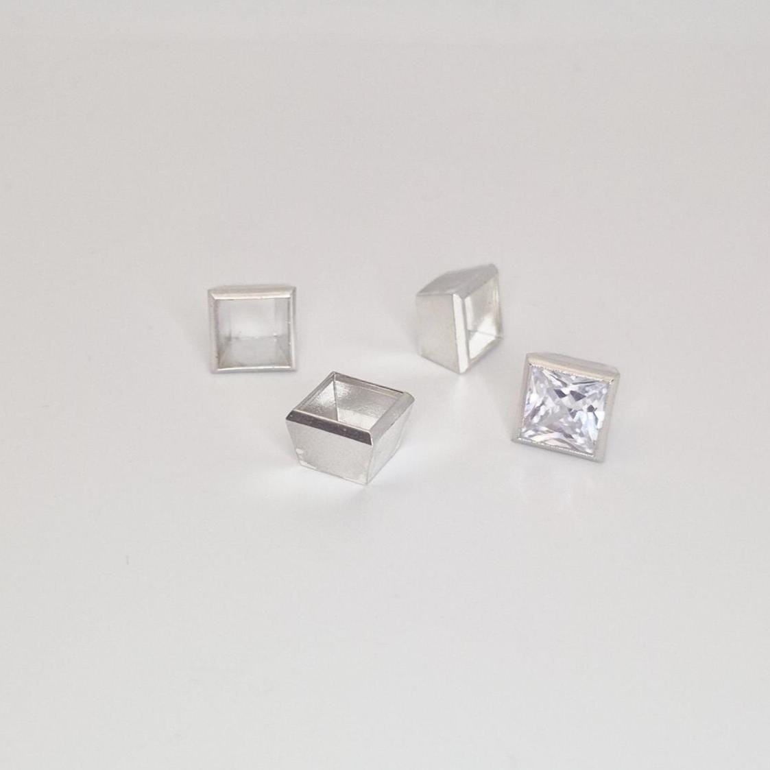 8mm square bezel setting in sterling silver with princess cut stone and additional setting components.