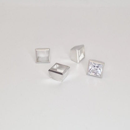 8mm square bezel setting in sterling silver with princess cut stone and additional setting components.