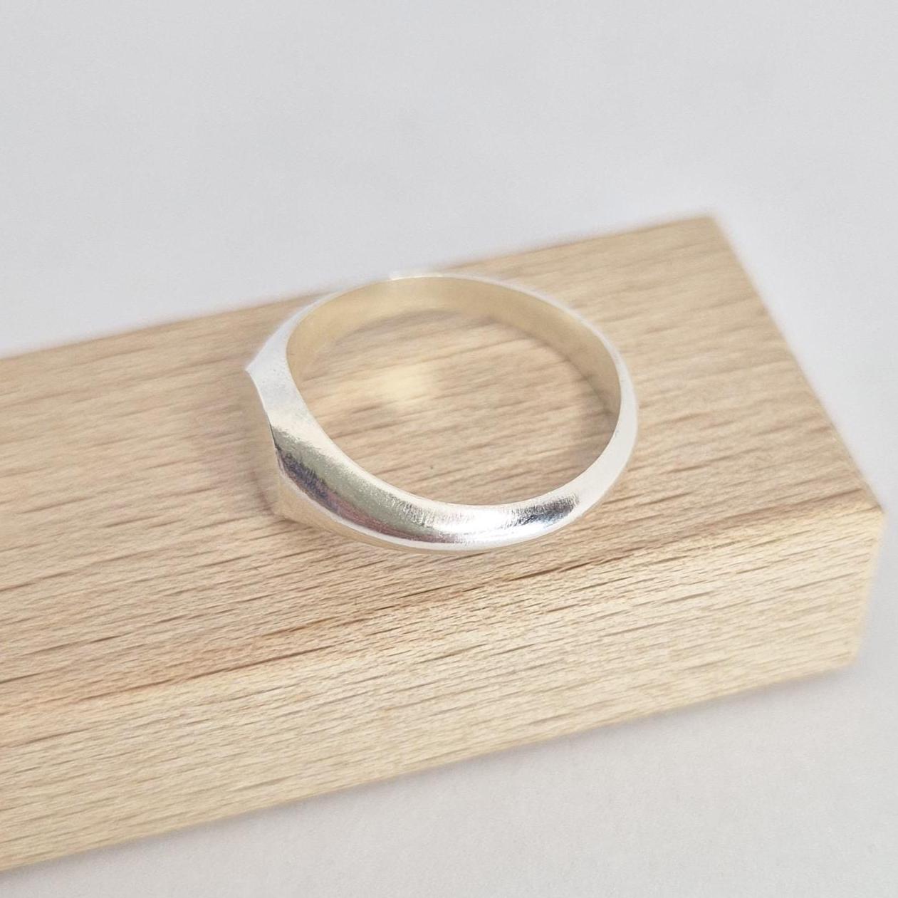 Sterling silver round signet ring blank angled side view, smooth tapered shoulders, jewellery making component