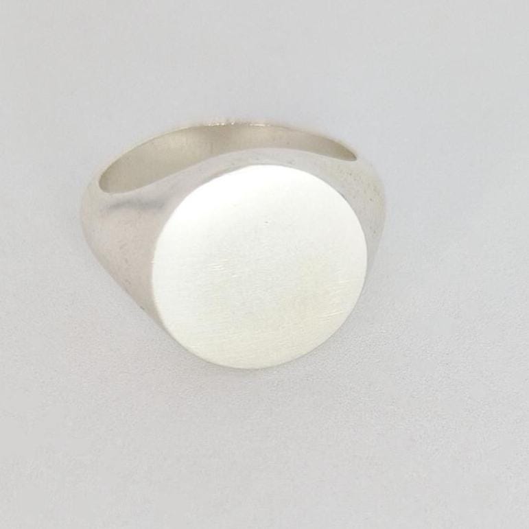 Front view of 16mm round signet ring blank, smooth matte top ready for engraving
