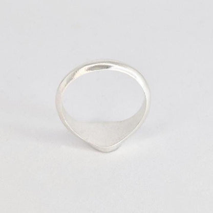 Rear view of oval signet ring highlighting band shape and taper toward the face
