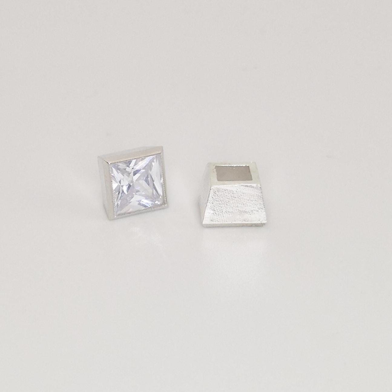 7mm square bezel cup setting in sterling silver with princess cut stone, side view of tapered setting.