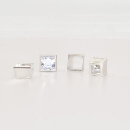 7mm bezel setting components in sterling silver with princess cut stones and open setting cups.
