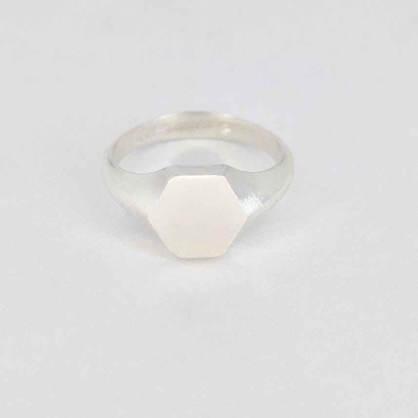 Hexagon signet ring in sterling silver front view, clean geometric face and minimalist design