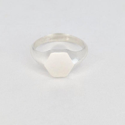 Hexagon signet ring in sterling silver front view, clean geometric face and minimalist design