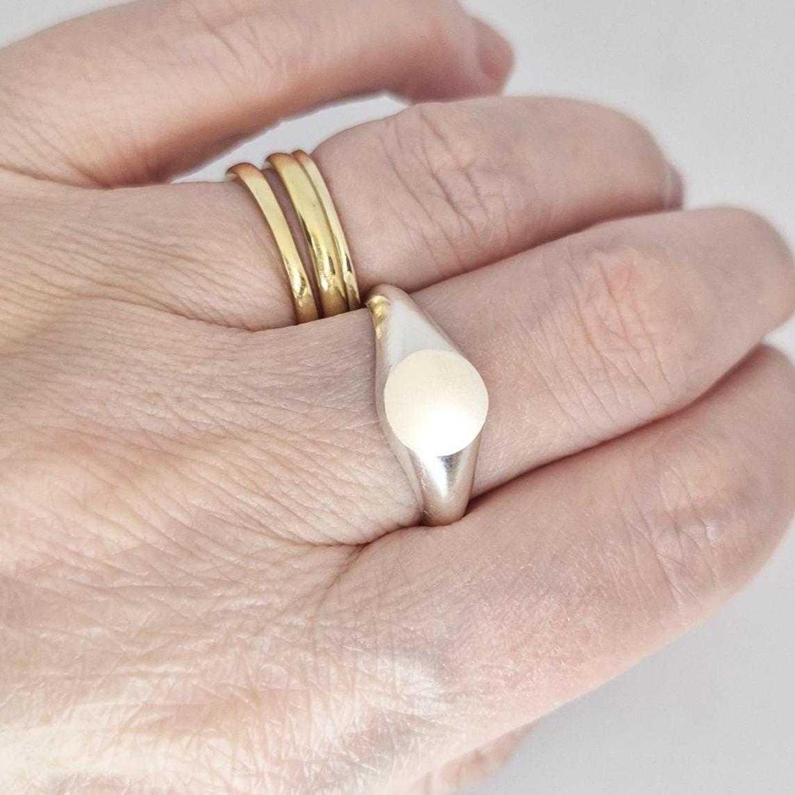 Sterling silver round signet ring worn on hand, blank engraving face, minimalist modern signet style