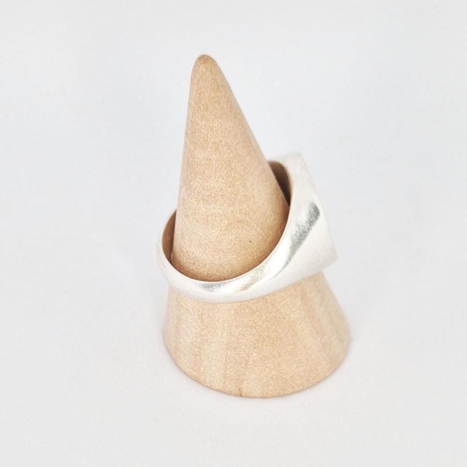 Rear view of signet ring on cone stand, smooth inner band and solid shank