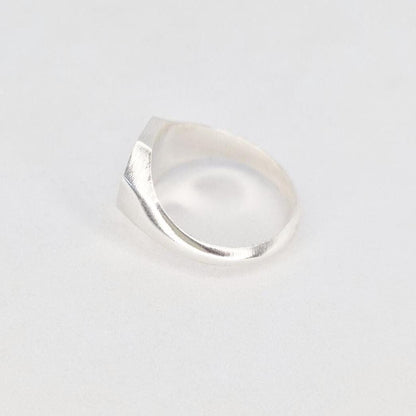 Side profile of octagon signet ring blank showing smooth tapered shank and solid construction in silver