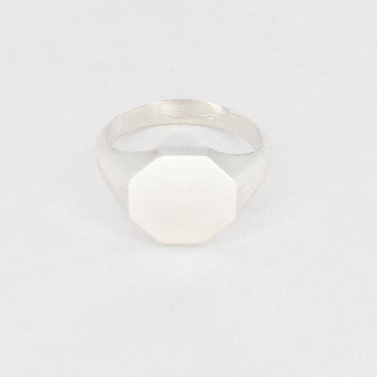 Front view of octagonal signet ring blank with flat face for engraving, minimalist silver ring design
