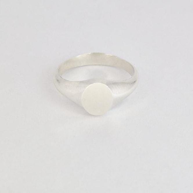Minimal oval signet ring on plain white background, centered product shot