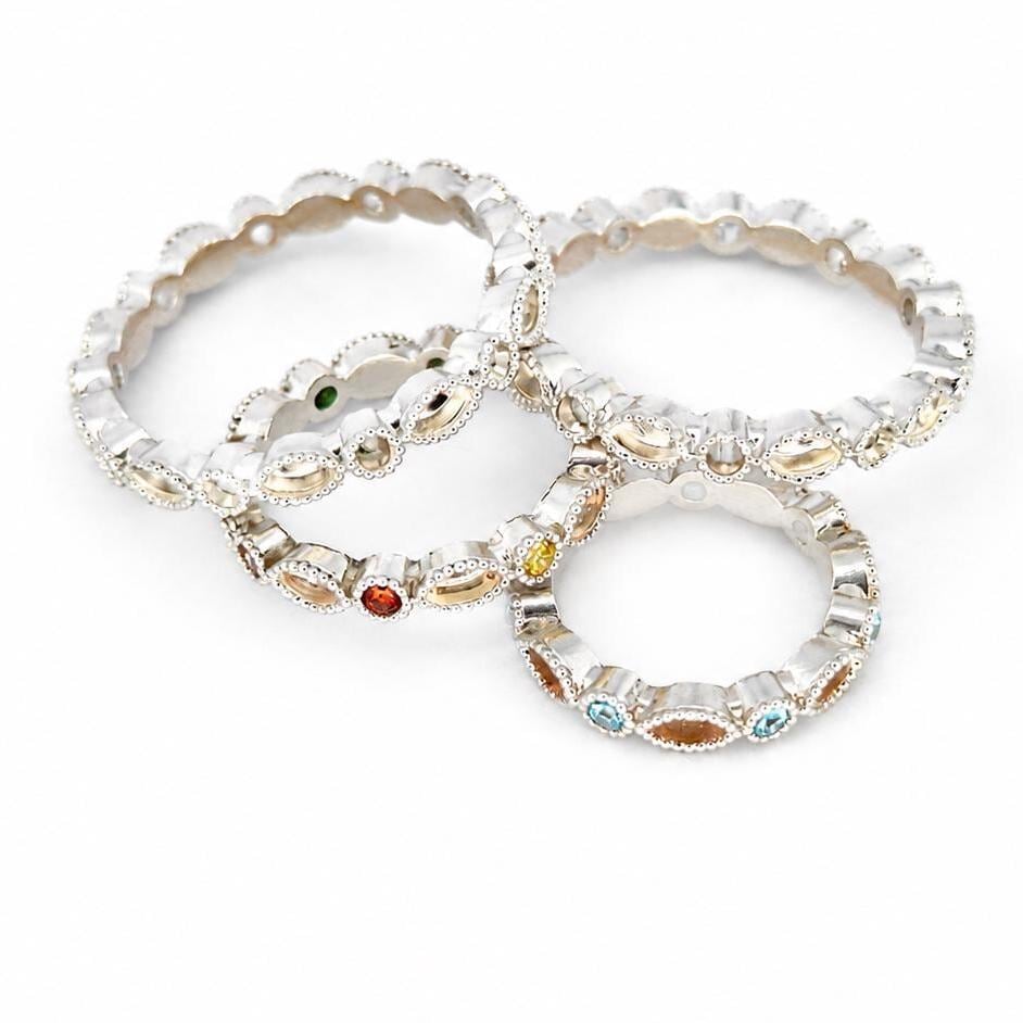 Four Argentium silver birthstone rings with blank bezels or coloured gemstones and marquise bezel settings for memorial resin.
