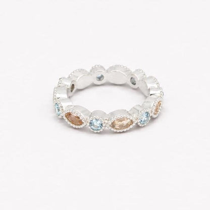 Two Argentium silver birthstone rings with aquamarine gemstones and marquise bezel settings for memorial resin.
